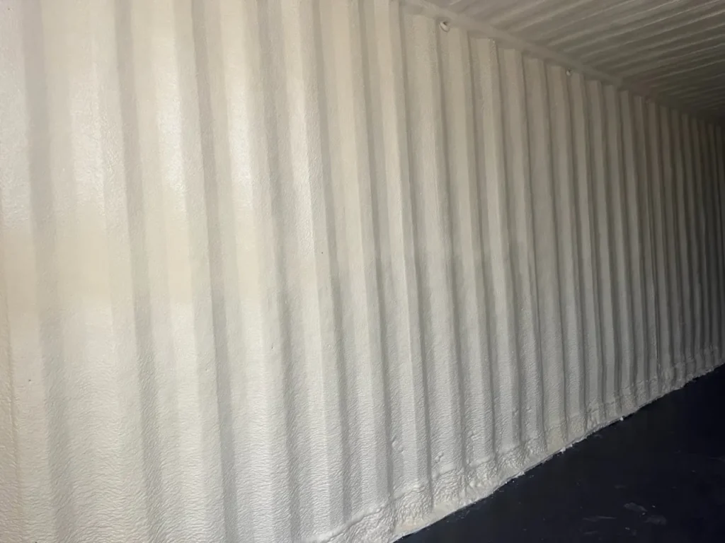 Container interior with white closed cell foam on walls and ceiling
