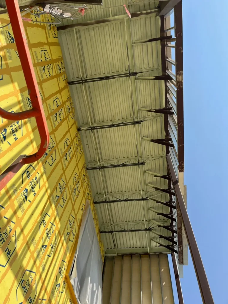 Metal roof deck foamed from below on a commercial building