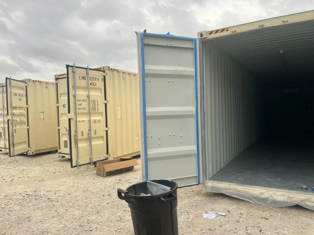 Shipping containers masked and prepped for closed cell foam